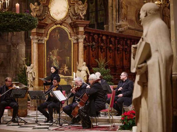 Choir and musicians performing near the altar in St. Stephen's Cathedral