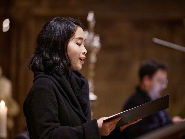 Female soloist singing during the Christmas concert in Vienna